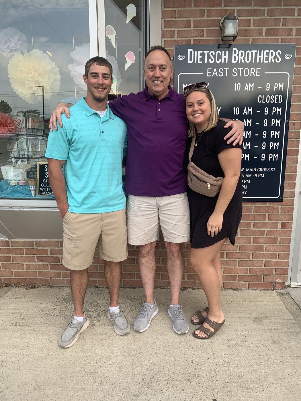 Greg Williamson with his son and daughter outside Dietsch Brothers in Findlay
